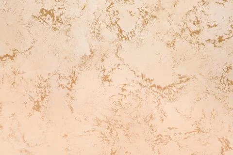 Beige wall with abstract brown patterns as background Stock Photos
