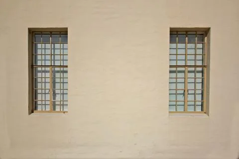 Beige wall two windows Stock Photos