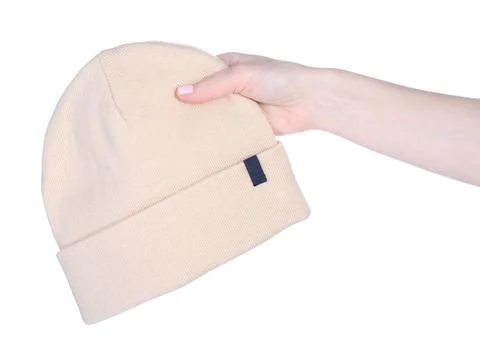 Beige warm hats in hand Stock Photos