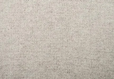 Beige wool knitted fabric Stock Photos
