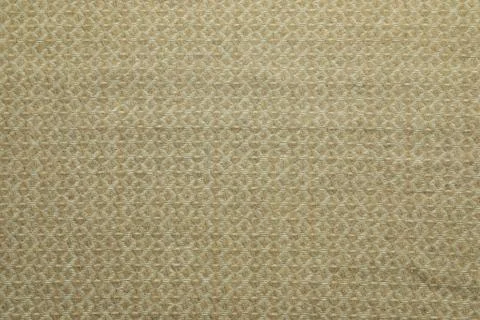 Beige woolen fabric with geometrical pattern as background, top view Stock Photos