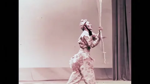 BEIJING - 1957 - In this Peking Opera, the Monkey King performs an acrobatic Stock Footage 323259898
