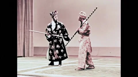 BEIJING - 1957 - In this Peking Opera, the Monkey King fights off two attackers. Stock Footage 323260128
