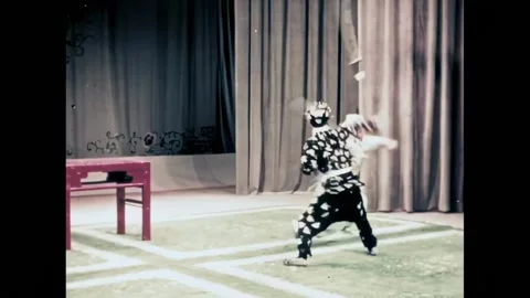 BEIJING - 1957 - In this Peking Opera, two men conclude an acrobatic fight scene Stock Footage 323265019