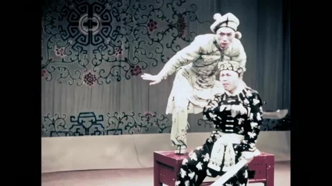 BEIJING - 1957 - In this Peking Opera, two men engage in an acrobatic fight Stock Footage 323265436