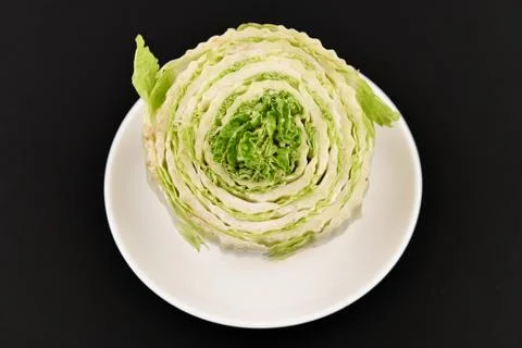 Beijing cabbage on a black background. Permanent manager of fresh, dietary gr 스톡 사진