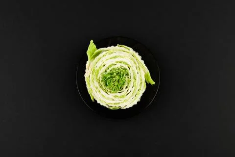 Beijing cabbage on a black background. Permanent manager of fresh, dietary gr 스톡 사진