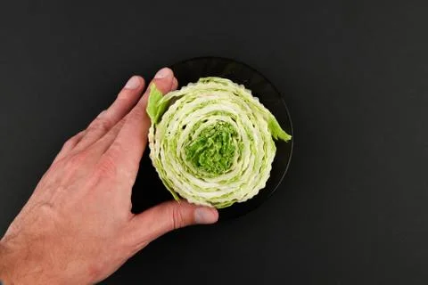 Beijing cabbage on a black background. Permanent manager of fresh, dietary gr 写真素材