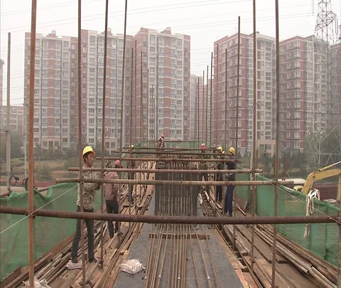 Beijing, China; Construction workers assemble scaffolding Stock Footage 86744288