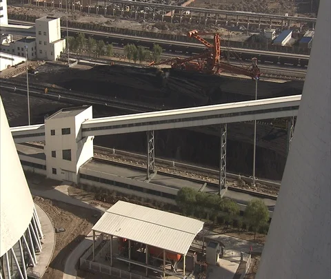 Beijing, China; High WS coal piles and conveyor at Hua Sanhe coal power plant Stock Footage 86746002