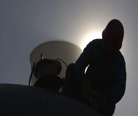 Beijing, China; MS worker and cooling tower of Shen Hua Sanhe coal power plant Stock Footage 86745954