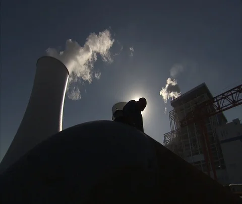 Beijing, China; MS worker and cooling towers of Shen Hua Sanhe coal power plant Stock Footage 86745962