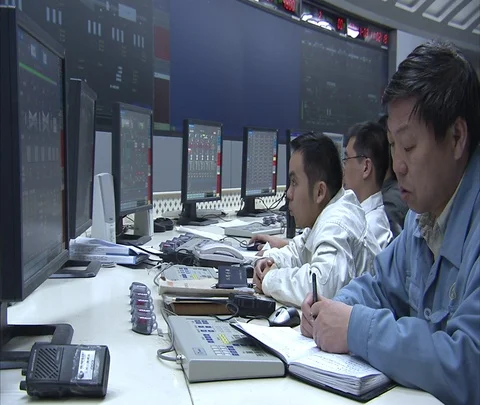 Beijing, China; MS workers at monitors in Shen Hua Sanhe coal power plant Stock Footage 86746140
