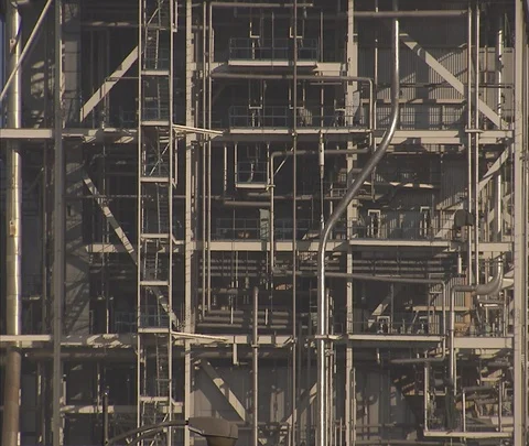 Beijing, China; Tangled grid of pipes and steel beams on exterior of power plant Stock Footage 86745812