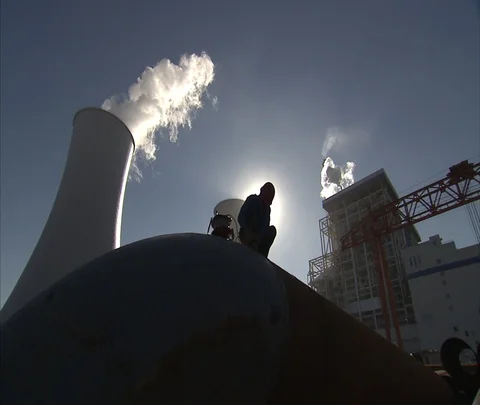 Beijing, China; WS worker and cooling towers of Shen Hua Sanhe coal power plant Stock Footage 86745945
