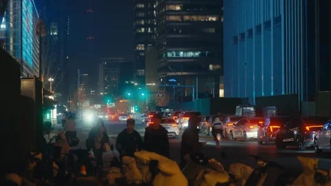 Beijing Dynamic night view of heavy traffic flowing through a modern skyscraper Video stock 337912159