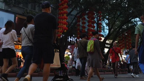 Beijing Lu. Evening time. People walk down the street, go to the shops. Stock Footage 118690726