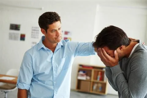 Being there when hes needed. A young man consoling his devastated friend. Foto stock