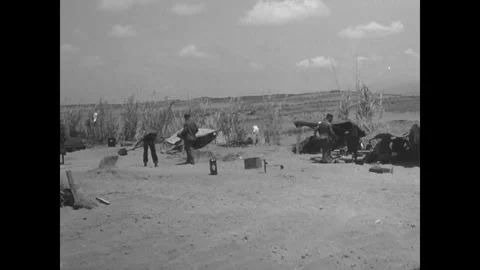 BEIRUT - 1958 - US Marines work from dugouts and camouflaged tents on a Beirut Stock Footage 340663593