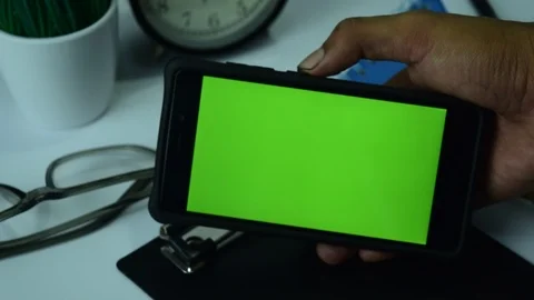 BEKASI, WEST JAVA, INDONESIA, APRIL 26, 2019 : Phone Green Screen shake Stock Footage 106965271