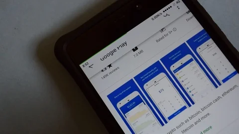 BEKASI, WEST JAVA, INDONESIA. MARCH 11, 2019 : install the Coinbase - Buy Stock Footage 104658896