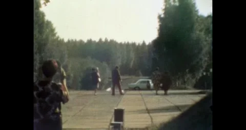 Belarus - circa 1970s: Soviet car and tourists at the parking of Khatyn Memorial 스톡 동영상 331511512