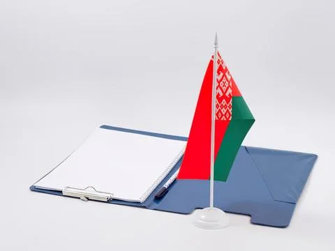Belarus flag on desk with notebook and laptop Stock Photos