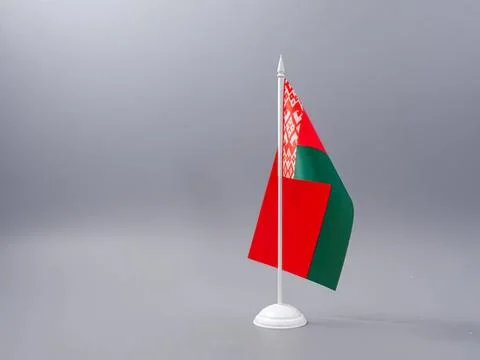 Belarus flag on small white stand in gray background Stock Photos