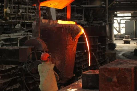Belarus, Minsk, 2014. Work in the foundry. molten metal worker at a metallurg Stock Photos
