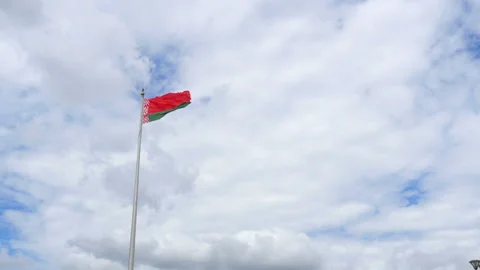 Belarusian flag is developing on the background of a cloudy sky Stock Footage 112064627