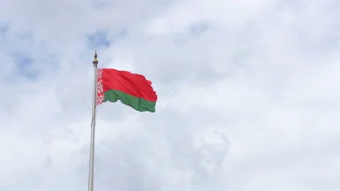 Belarusian flag is developing on the background of a cloudy sky Stock Footage 112065160