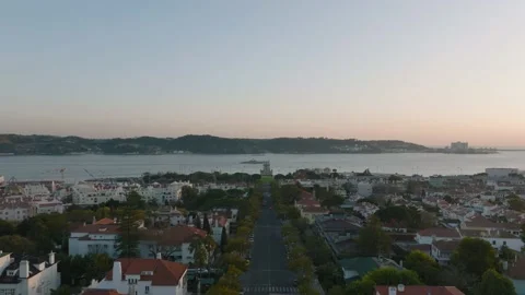 Belém Tower during sunset with a warship passing Video stock 184493536