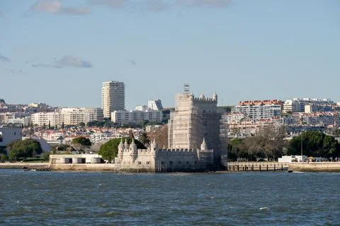 Belem Tower restoration with dense Lisbon skyline Foto stock
