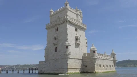 Belem Tower on the Tagus river in Lisbon, Portugal. Tilt Down Shot Stock Footage 346343422