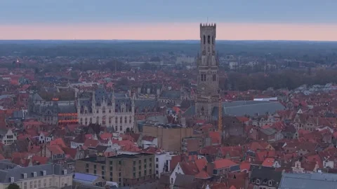 Belfry of Bruges Sunset: Dramatic Cloudy Skies Over the Medieval Cityscape Stock-Footage 325531183