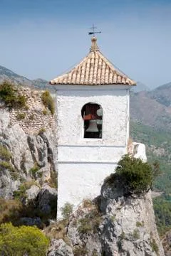 Belfry on the peak of the mountain. Stock Photos