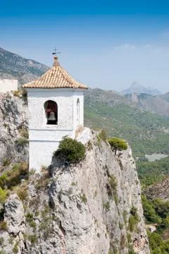 Belfry on the peak of the mountain. Stock Photos