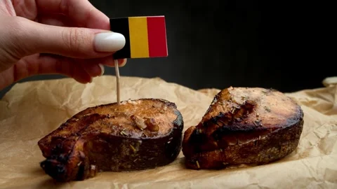 Belgian flag on grilled fish, symbol of North Sea seafood for Belgian market. Stock Footage 323010155