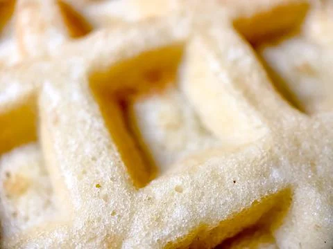 Belgian waffle closeup of a cooked waffle. Photography of desserts. Stock Photos