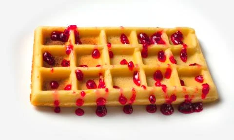 Belgian waffle with raspberry jam on a white background isolate. Stock Photos