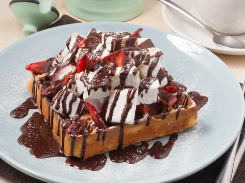 Belgian waffle with strawberries, chocolate and marshmallows Stock Photos