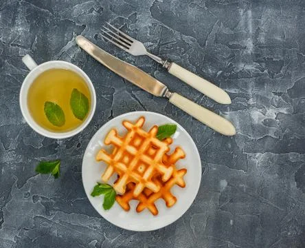 Belgian waffles and Tea. Stock Photos