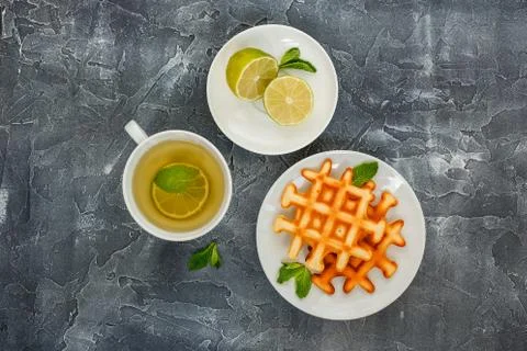 Belgian waffles and Tea. Stock Photos