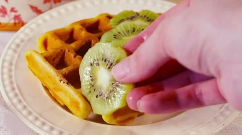 Belgian waffles with chocolate chips sprinkled arm Stock Footage 67552270