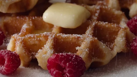 Belgian Waffles Closeup Sprinkled with Powdered Confectioner Sugar Stock Footage 113719592
