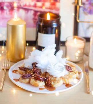 Belgian waffles with maple syrup and pecan on a wooden table, breakfast, no.. Stock Photos