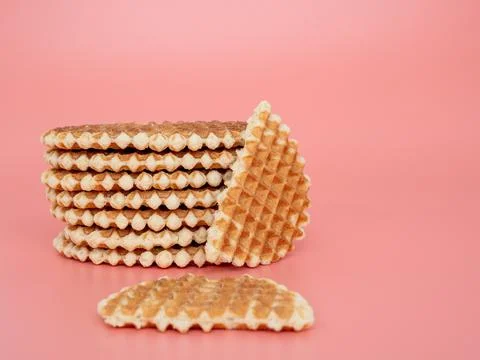 Belgian waffles on a pink background. Stock Photos