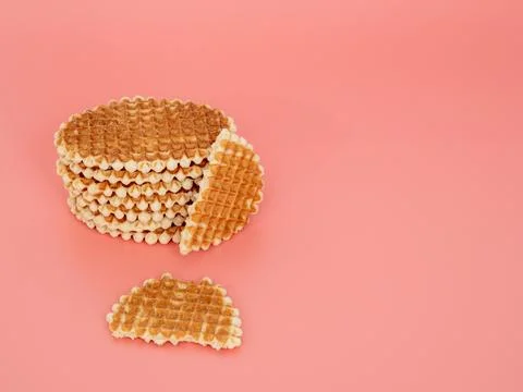 Belgian waffles on a pink background. Stock Photos