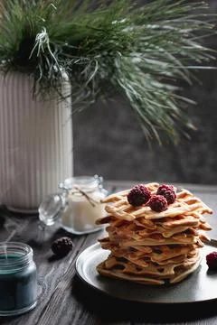 Belgian waffles stack with blackberries on top Stock Photos