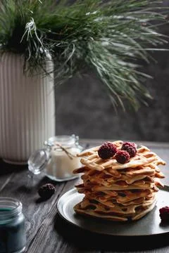 Belgian waffles stack with blackberries on top Stock Photos